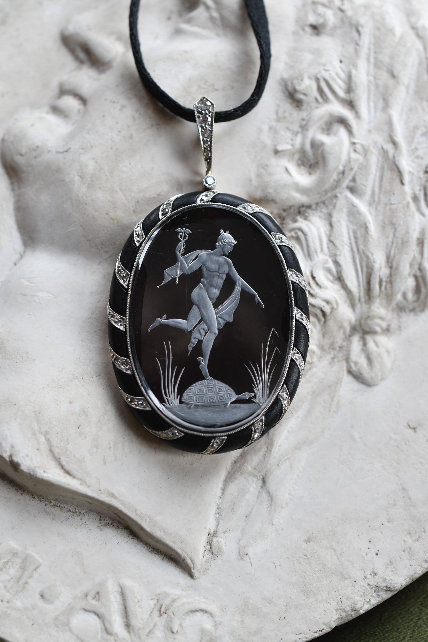 Antique Reverse Intaglio Rock Crystal, Jet and Diamond Pendant depicting Hermes and Chelone